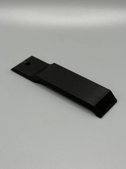 Ein schwarzer Ersatzklipp für die Pager Holster